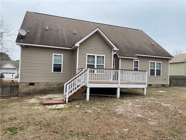 back of house with a deck