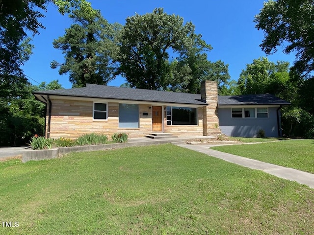 ranch-style house with a front lawn