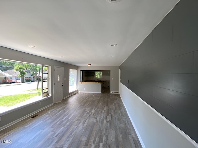 unfurnished living room with hardwood / wood-style flooring