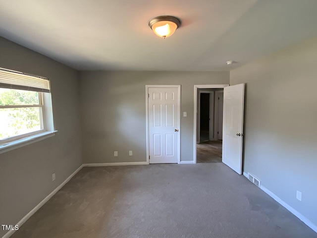 unfurnished bedroom featuring carpet flooring