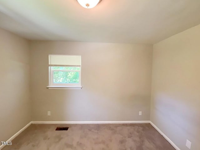 spare room with carpet