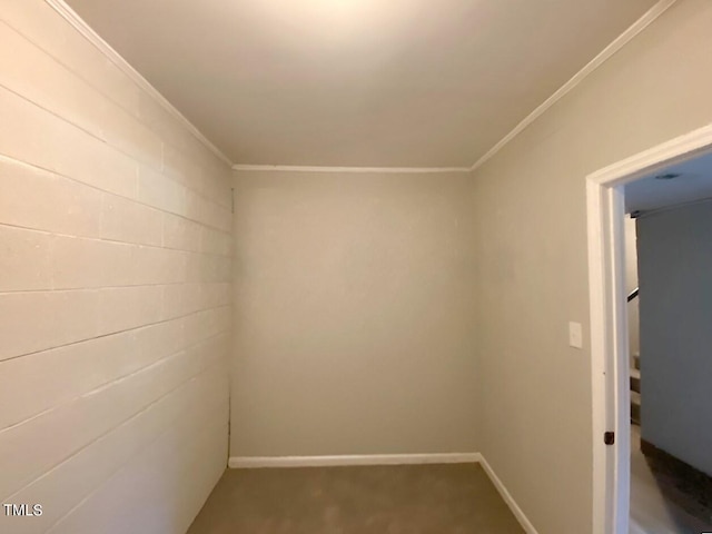 carpeted spare room with crown molding