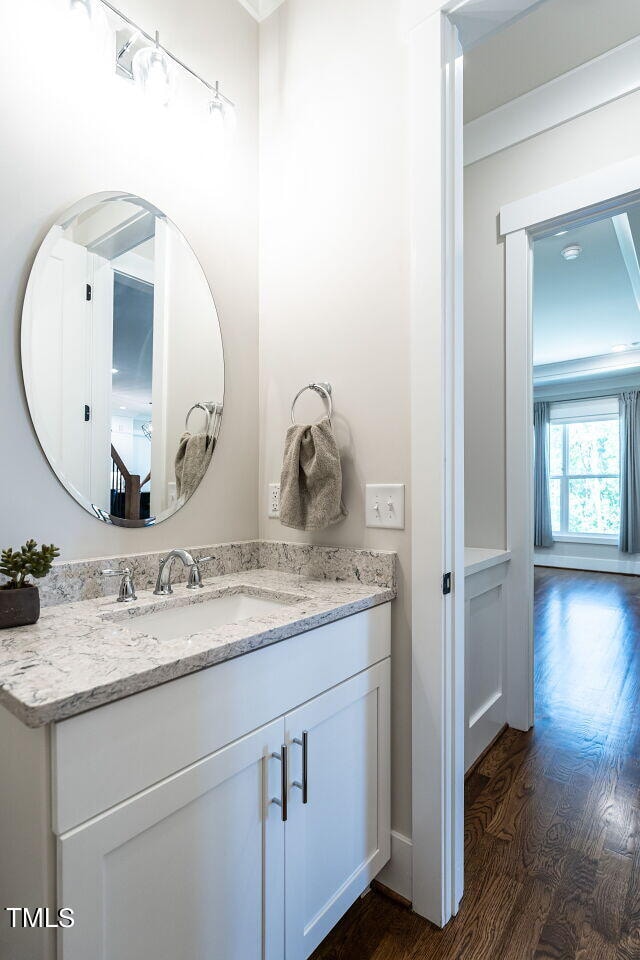 bathroom featuring vanity and hardwood / wood-style flooring