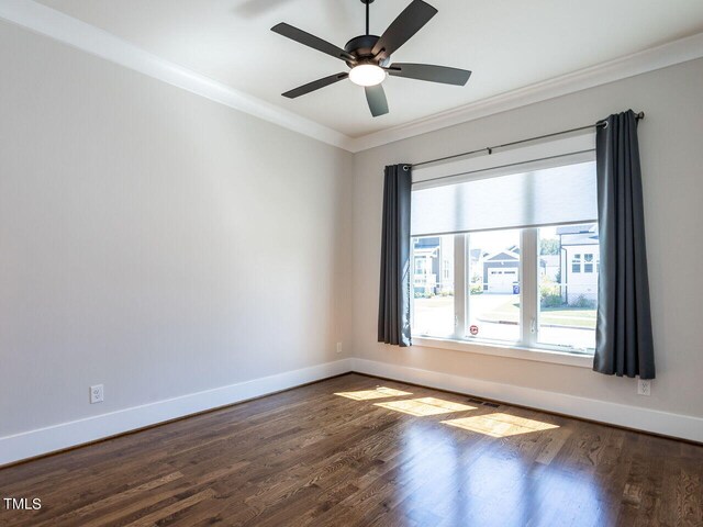 empty room featuring ceiling fan, wood-type flooring, and ornamental molding