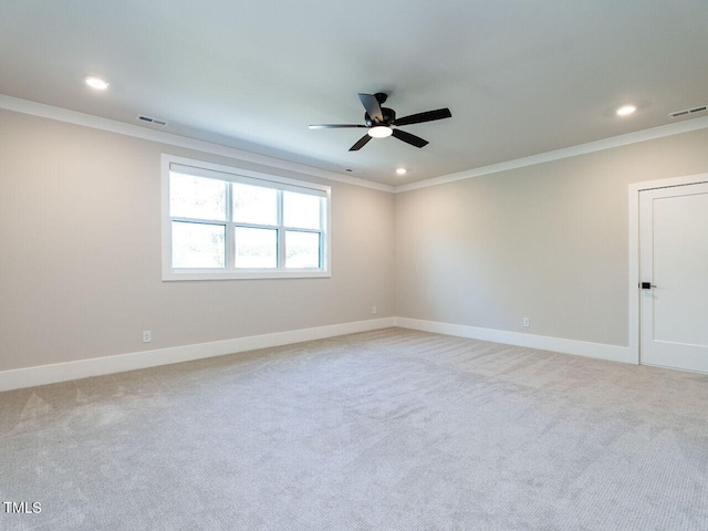 unfurnished room with ornamental molding, light carpet, and ceiling fan