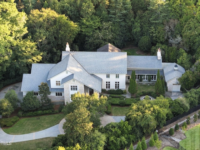 drone / aerial view with a view of trees