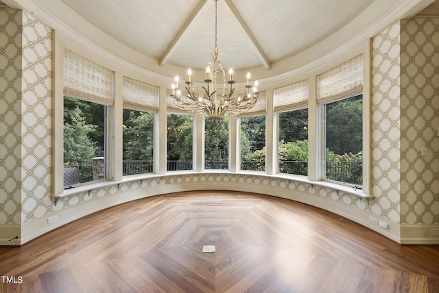 unfurnished sunroom featuring beam ceiling and a notable chandelier