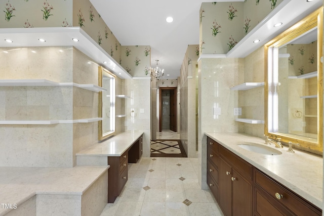 full bath featuring wallpapered walls, recessed lighting, vanity, and a chandelier