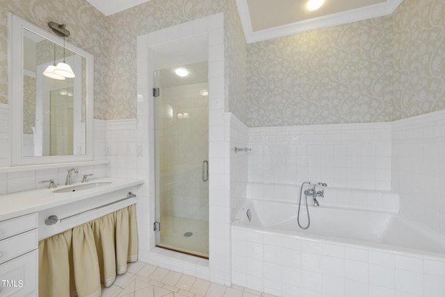 bathroom with vanity, a bath, a shower stall, and wallpapered walls