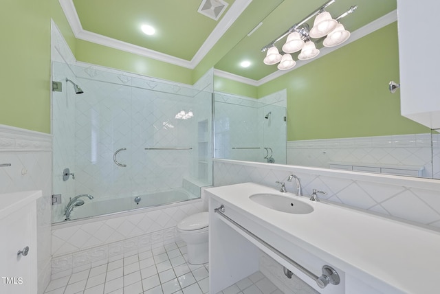 bathroom with tiled shower / bath combo, toilet, visible vents, and ornamental molding