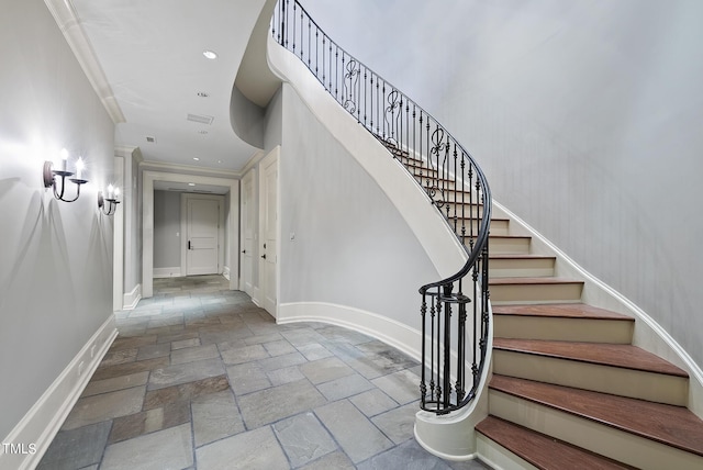 stairs featuring visible vents, recessed lighting, baseboards, and stone tile flooring