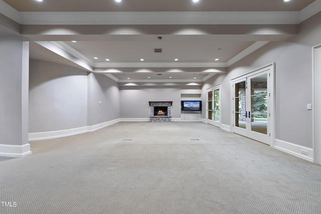 unfurnished living room featuring recessed lighting, french doors, baseboards, and ornamental molding