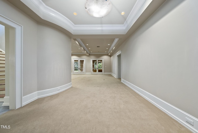 hallway featuring carpet flooring, baseboards, and ornamental molding