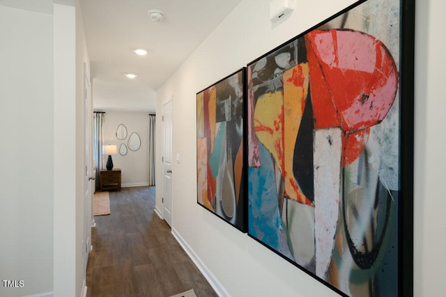 hallway with dark wood-type flooring