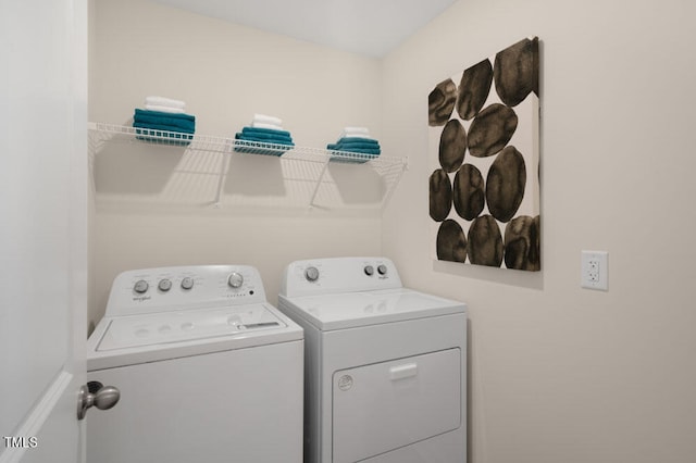 washroom with washer and clothes dryer