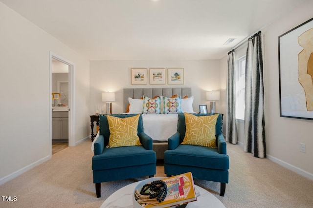 interior space featuring light colored carpet and ensuite bathroom