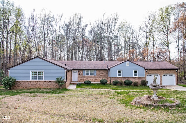 single story home with a garage and a front yard