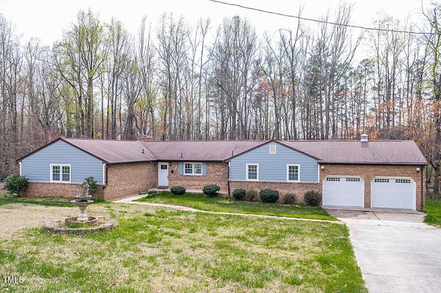 ranch-style home with a front yard and a garage