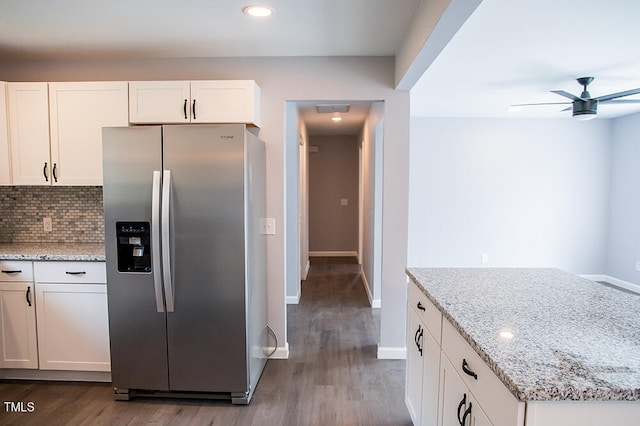 kitchen with ceiling fan, stainless steel fridge, wood-type flooring, and white cabinetry