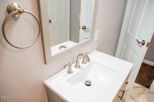 bathroom with vanity and hardwood / wood-style flooring