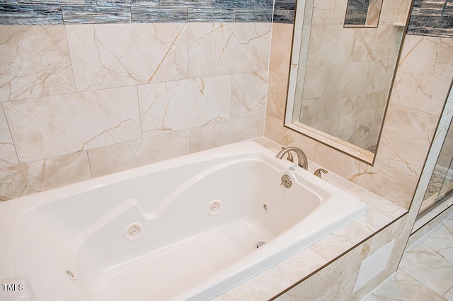 bathroom with tiled tub