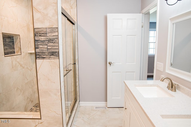 bathroom featuring vanity and a tile shower