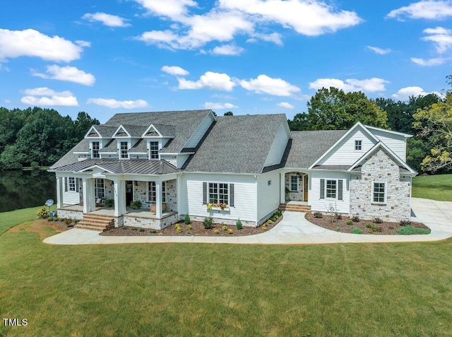 view of front of house with a porch and a front yard