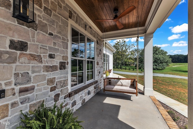 view of patio / terrace with ceiling fan and covered porch