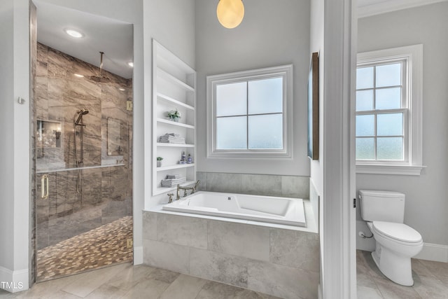 bathroom with tile patterned flooring, toilet, and separate shower and tub