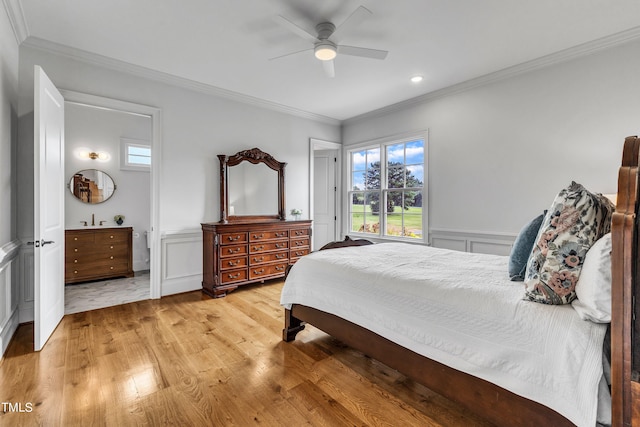 bedroom with sink, crown molding, ceiling fan, and light hardwood / wood-style flooring