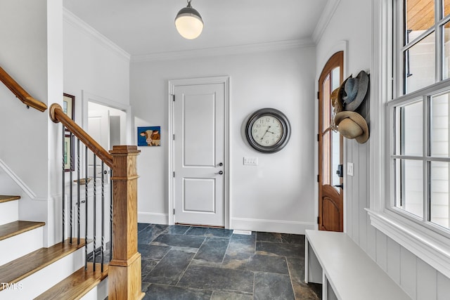 entryway featuring crown molding