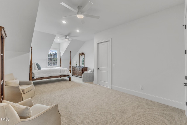 carpeted bedroom featuring ceiling fan and vaulted ceiling