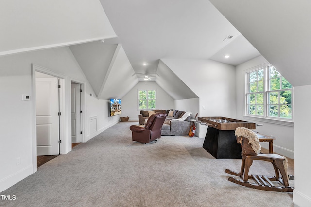 carpeted living room featuring lofted ceiling and ceiling fan