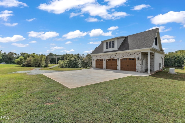 view of side of home featuring a garage and a yard