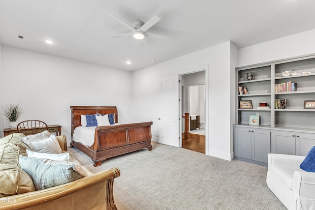 bedroom featuring light carpet and ceiling fan