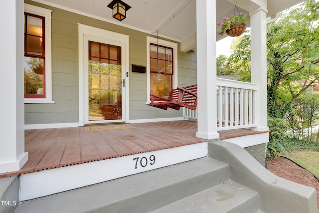 doorway to property featuring a porch