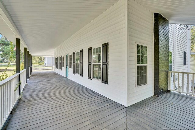 wooden terrace featuring a porch