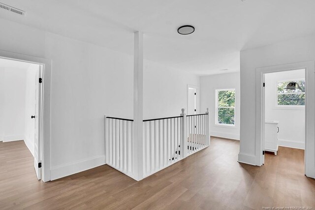 hallway featuring wood-type flooring