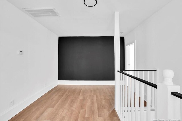 unfurnished room with light hardwood / wood-style flooring