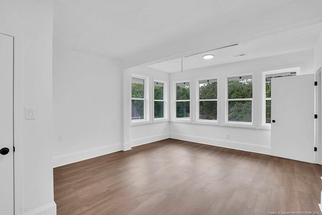 empty room featuring dark hardwood / wood-style floors