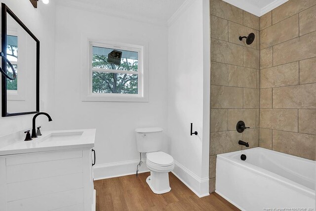 full bathroom with vanity, toilet, wood-type flooring, and a wealth of natural light