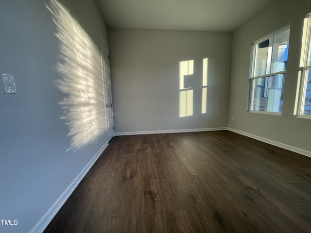 spare room featuring dark hardwood / wood-style floors