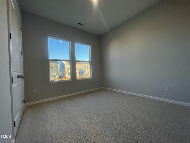 empty room with carpet flooring