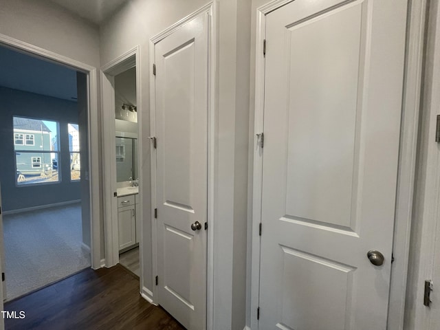 hallway with dark wood-type flooring