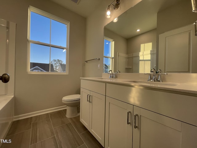 bathroom with vanity and toilet