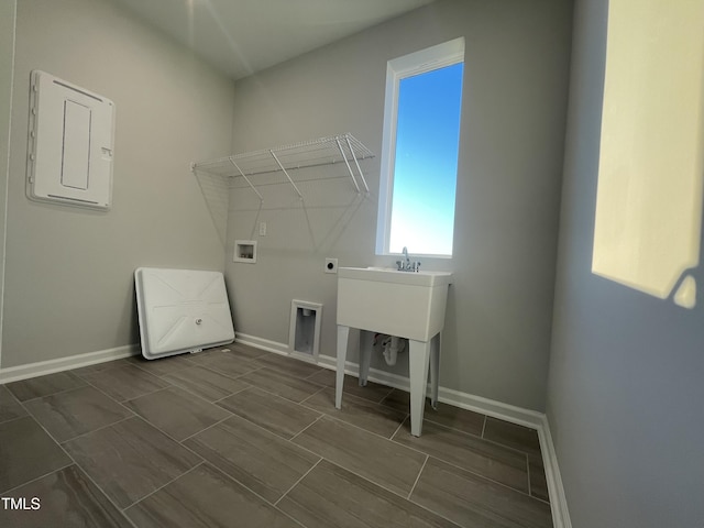 washroom featuring electric dryer hookup, electric panel, and hookup for a washing machine