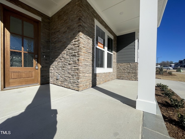 view of patio featuring a porch