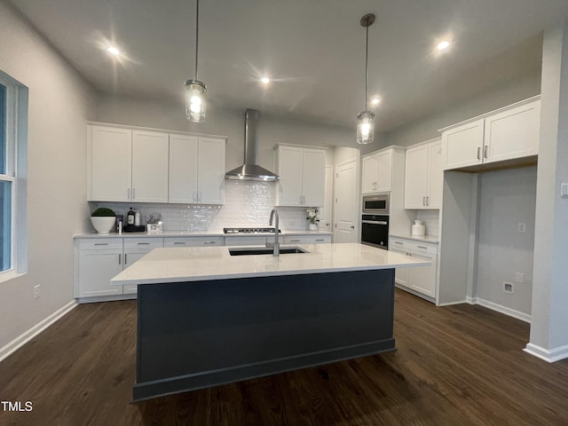 321 Murray Grey Ln, Wake Forest, NC 27587 - kitchen with wall chimney range hood, oven, a sink, baseboards, and backsplash