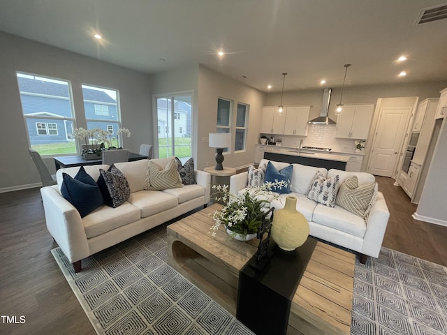 321 Murray Grey Ln, Wake Forest, NC 27587 - living room with dark wood-style flooring, recessed lighting, and baseboards