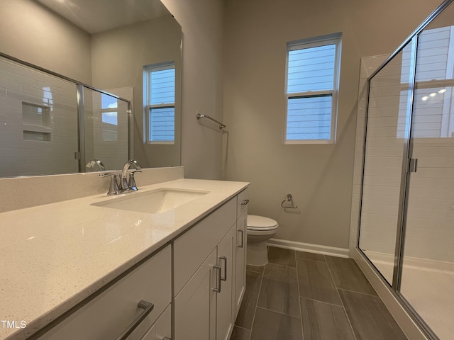 321 Murray Grey Ln, Wake Forest, NC 27587 - full bathroom featuring baseboards, a stall shower, vanity, and toilet